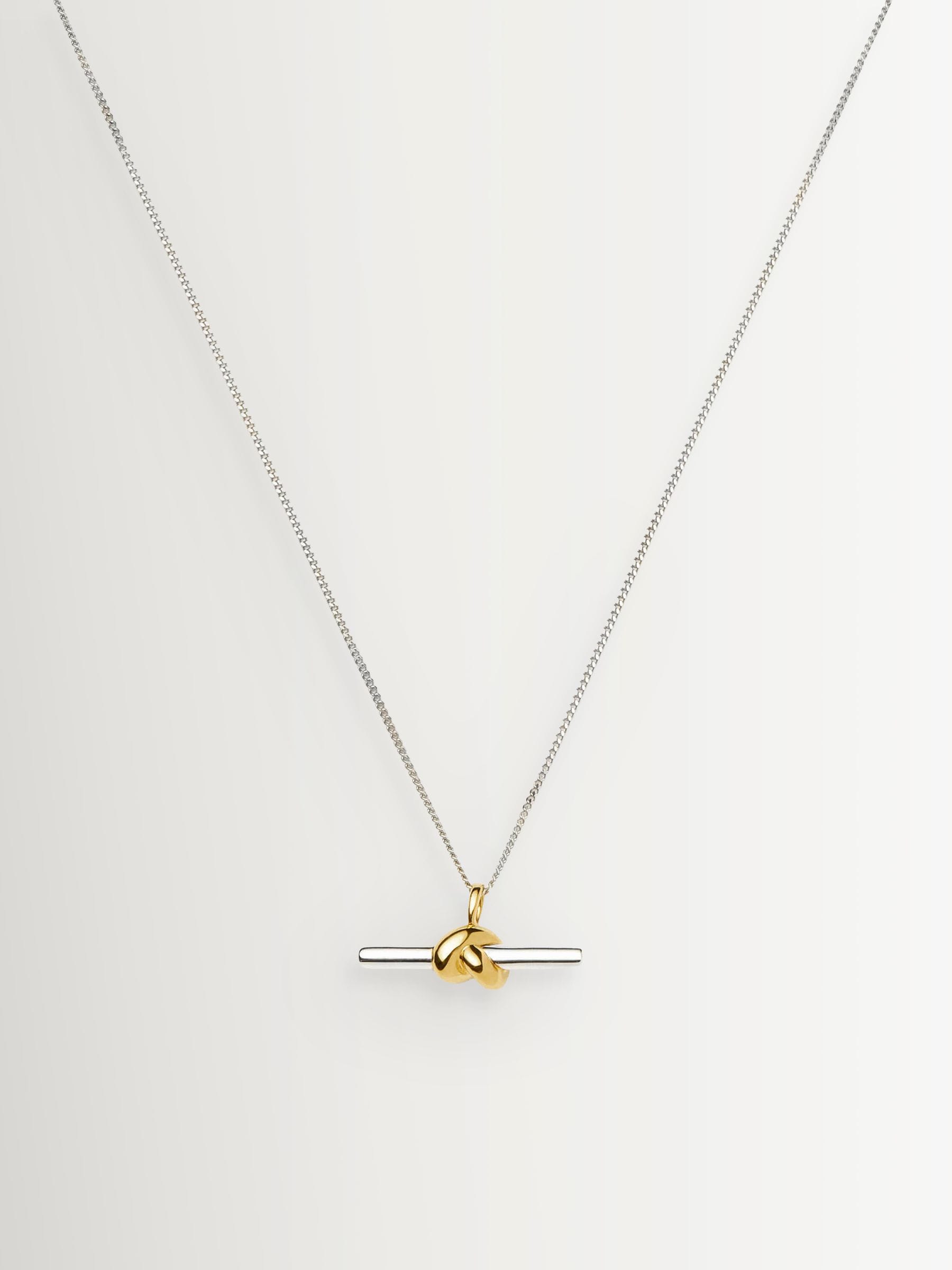 Missoma gold tone T-bar knot pendant necklace, imported from the UK