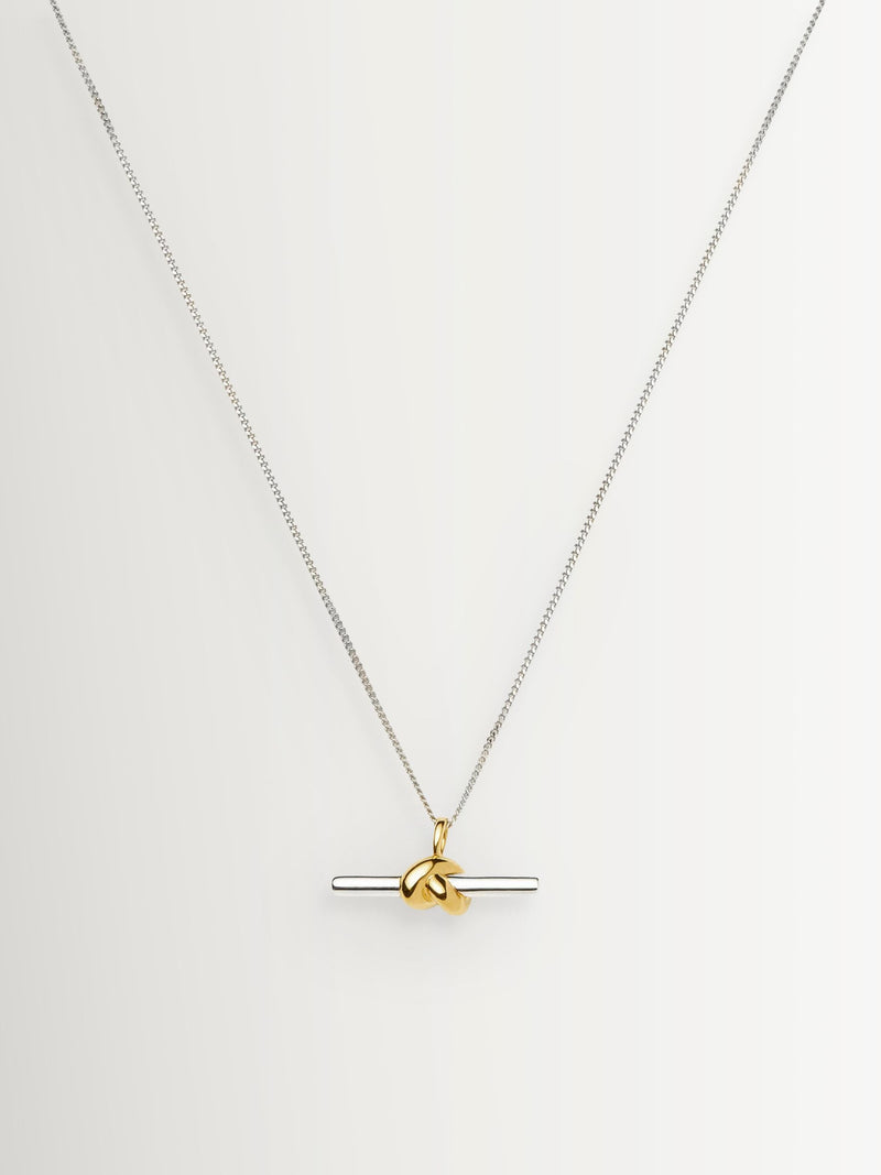 Missoma gold tone T-bar knot pendant necklace, imported from the UK