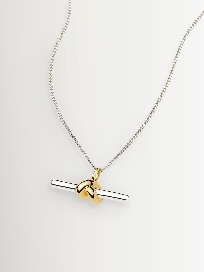 Missoma gold tone T-bar knot pendant necklace, imported from the UK