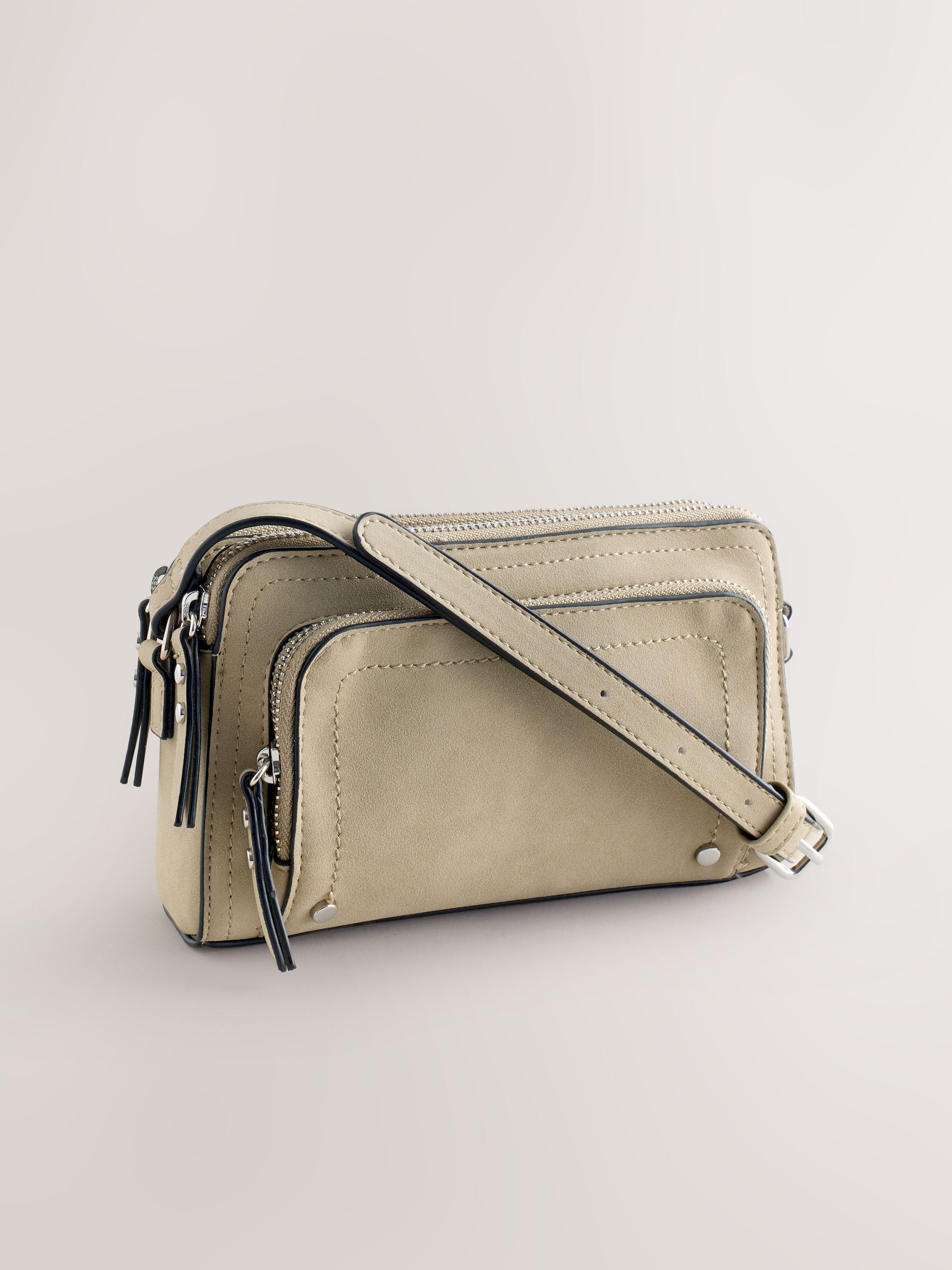 Stone double zip cross-body bag in faux suede, imported from the UK