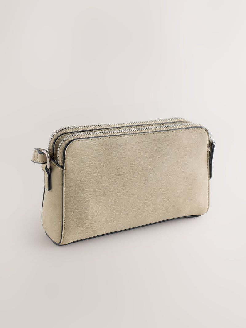 Stone double zip cross-body bag in faux suede, imported from the UK