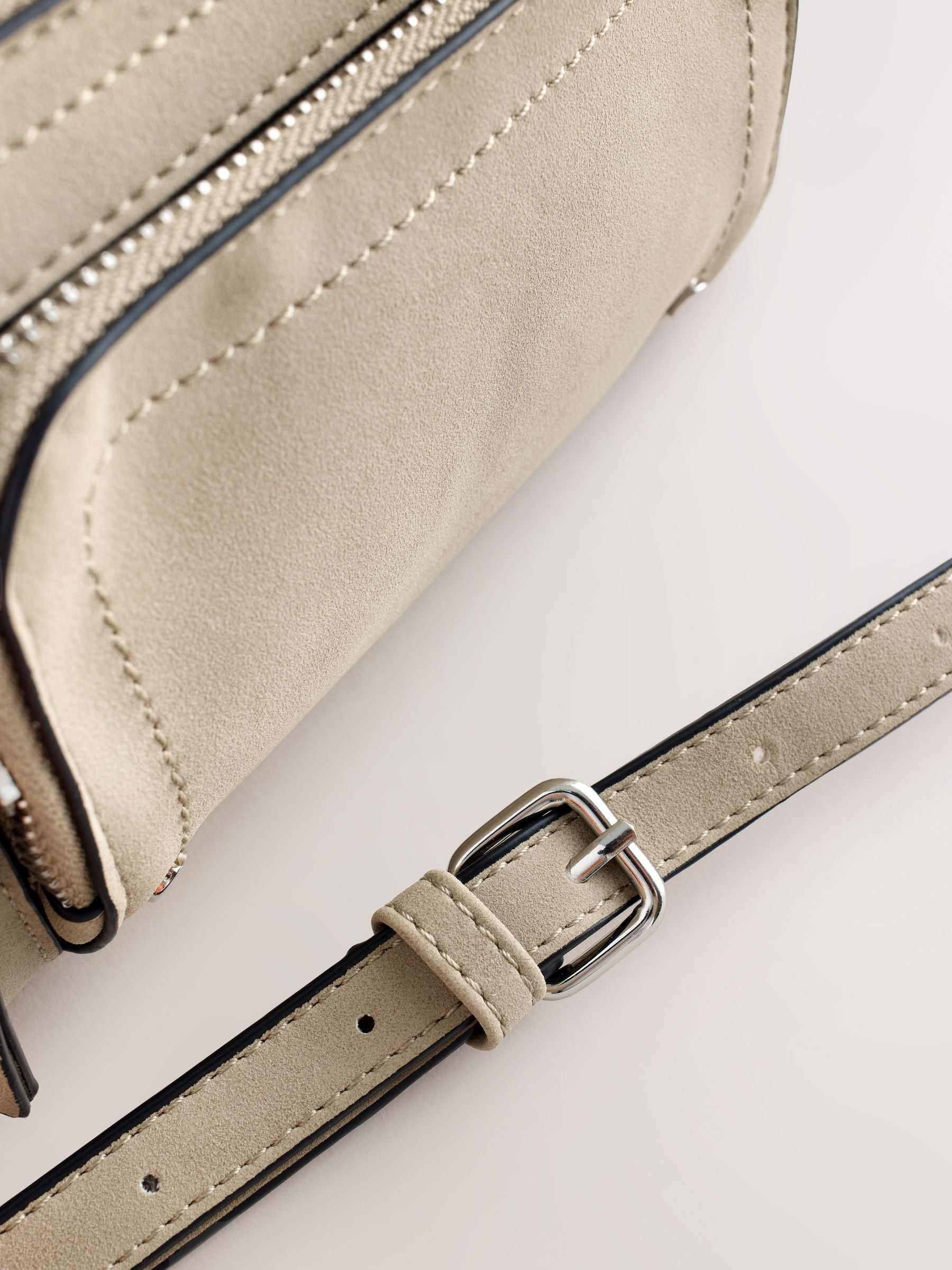 Stone double zip cross-body bag in faux suede, imported from the UK