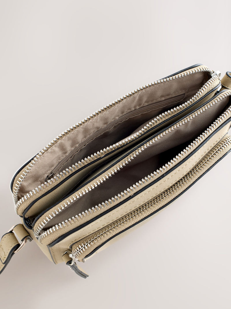 Stone double zip cross-body bag in faux suede, imported from the UK