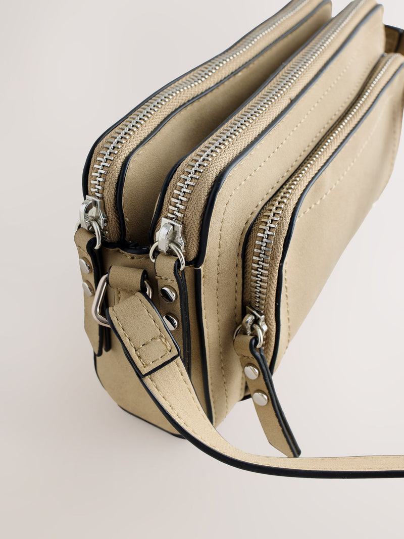 Stone double zip cross-body bag in faux suede, imported from the UK