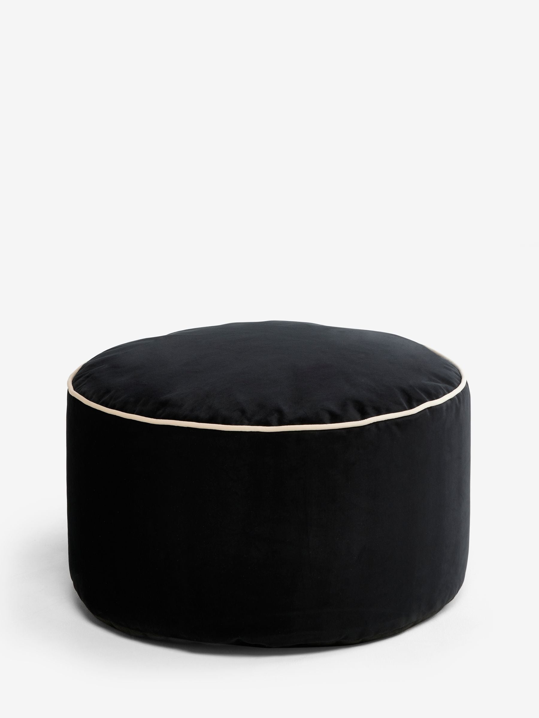 Black velvet pouffe with contrast piping, British brand