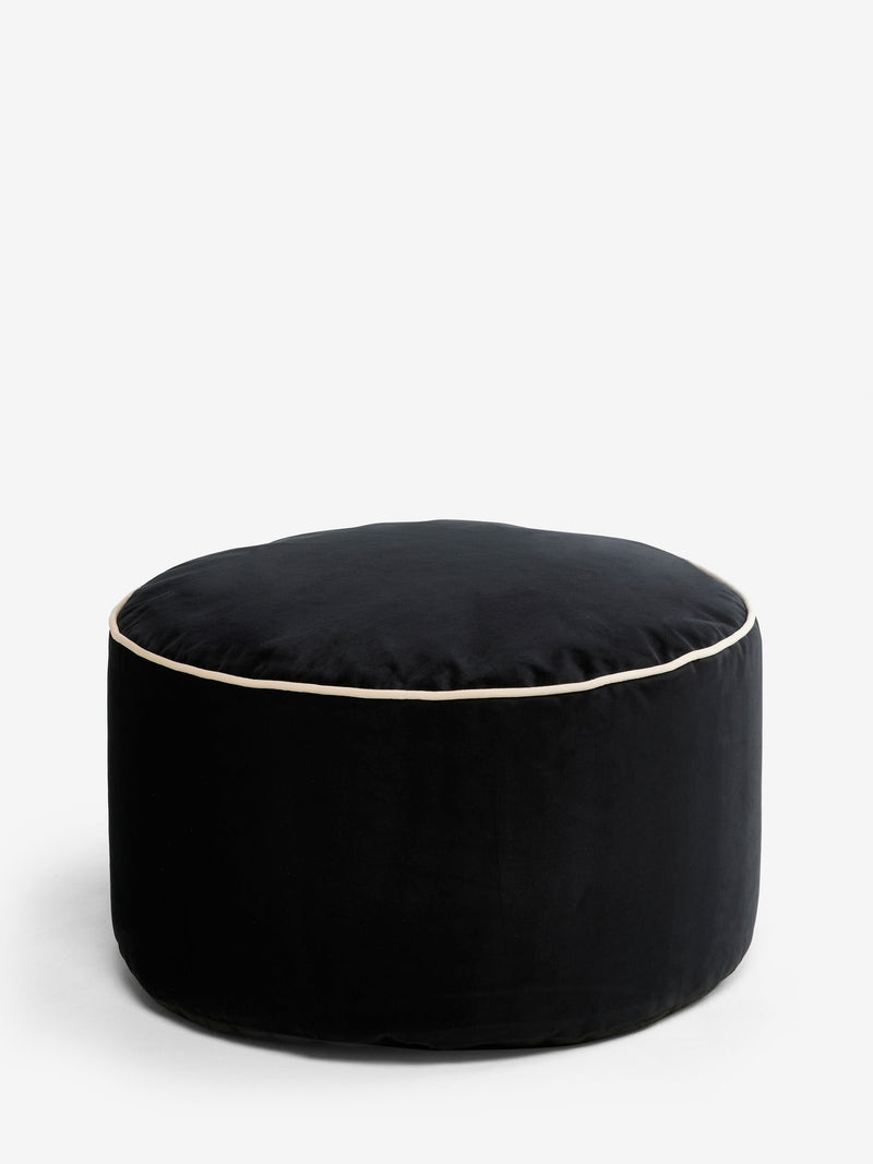 Black velvet pouffe with contrast piping, British brand