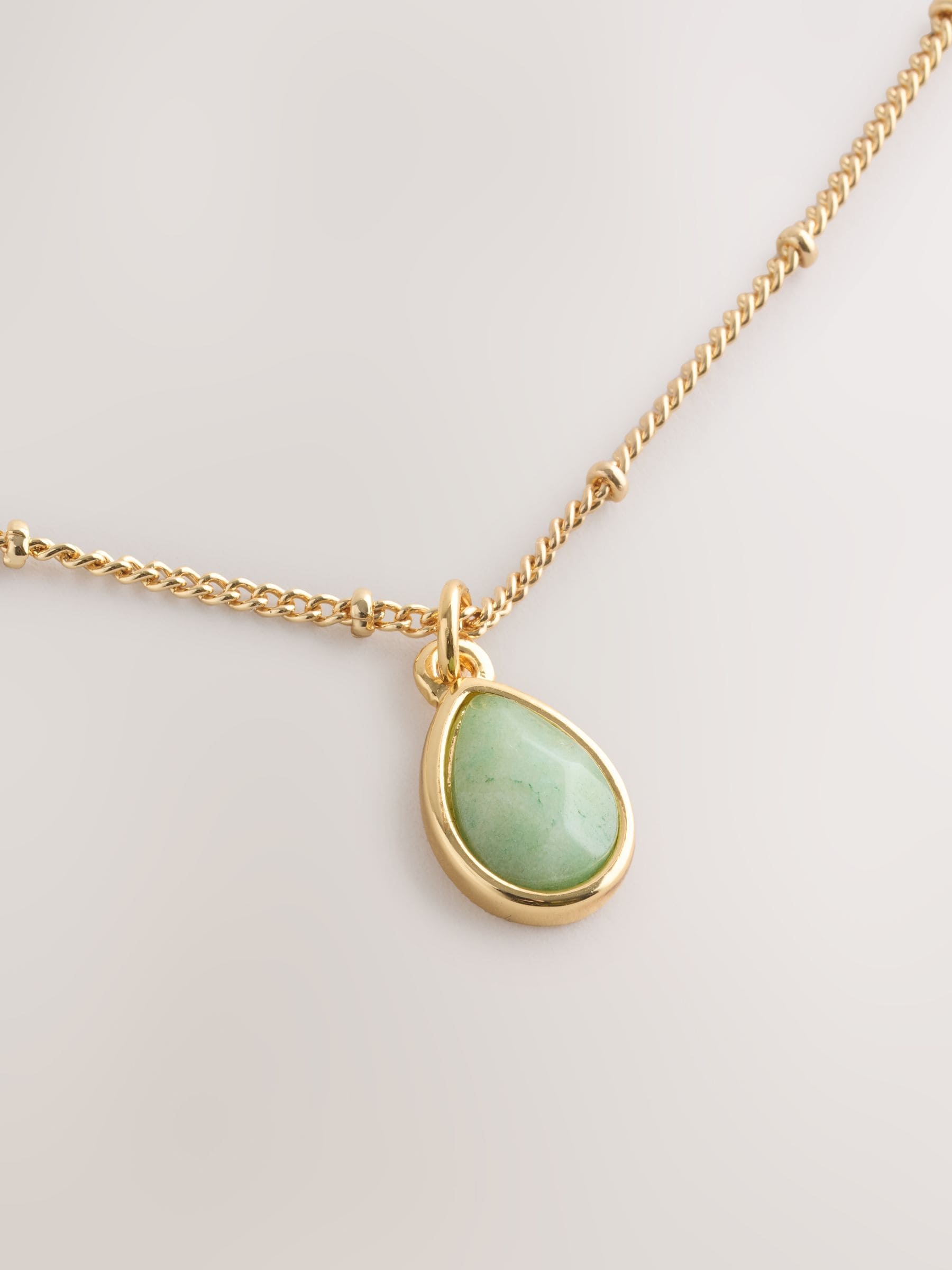 Gold tone semi-precious stone pendant necklace, UK version