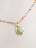 Gold tone semi-precious stone pendant necklace, UK version