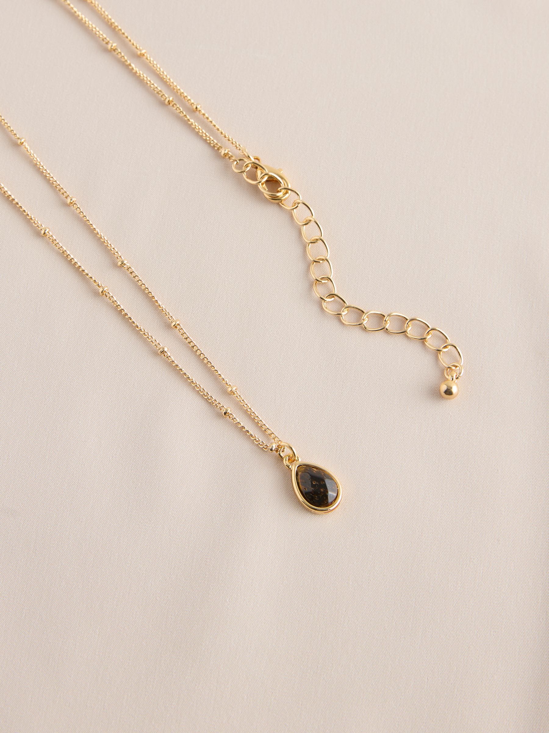 Gold tone semi-precious stone pendant necklace, UK version