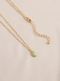 Gold tone semi-precious stone pendant necklace, UK version