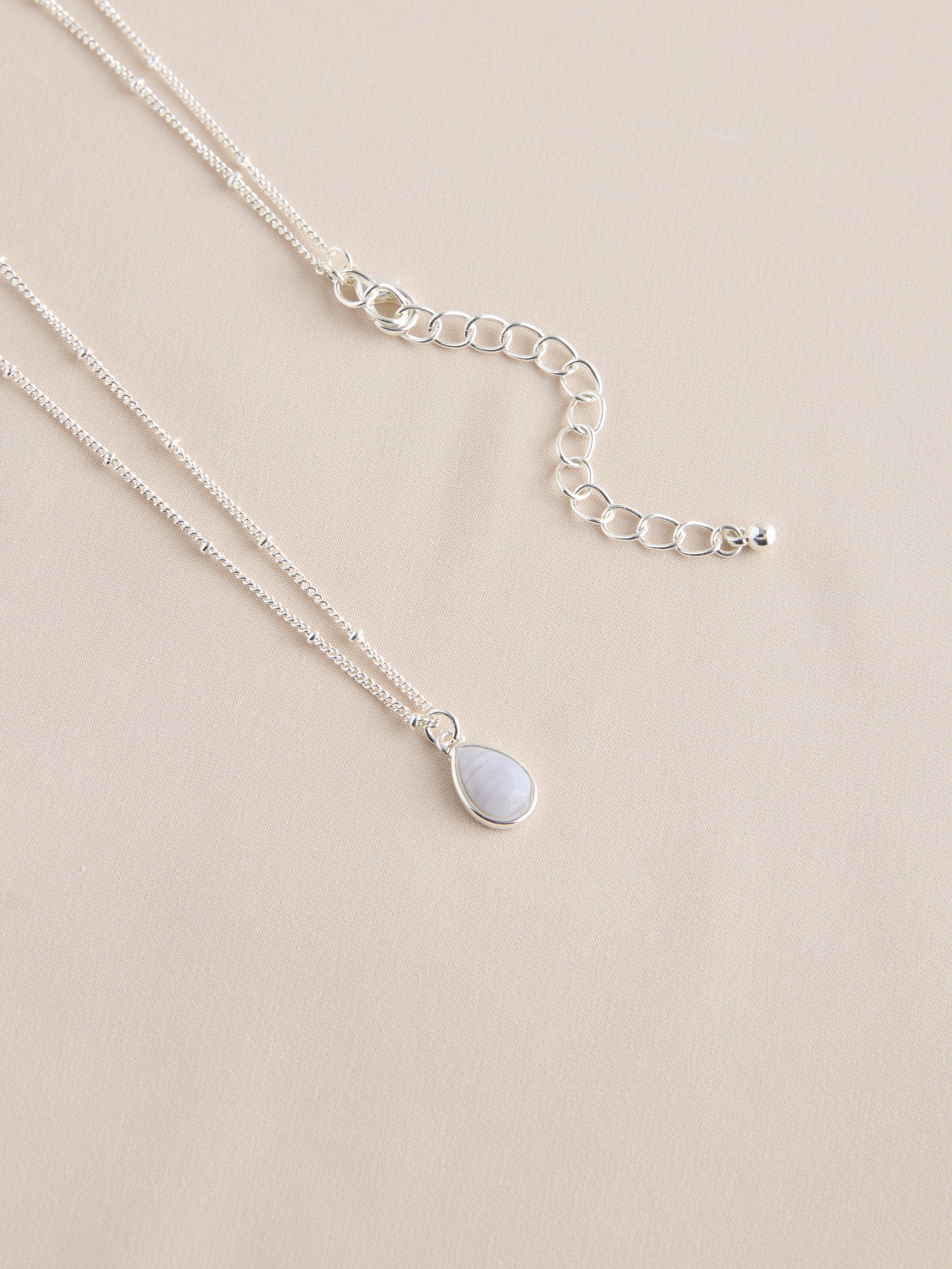 Gold tone semi-precious stone pendant necklace, UK version