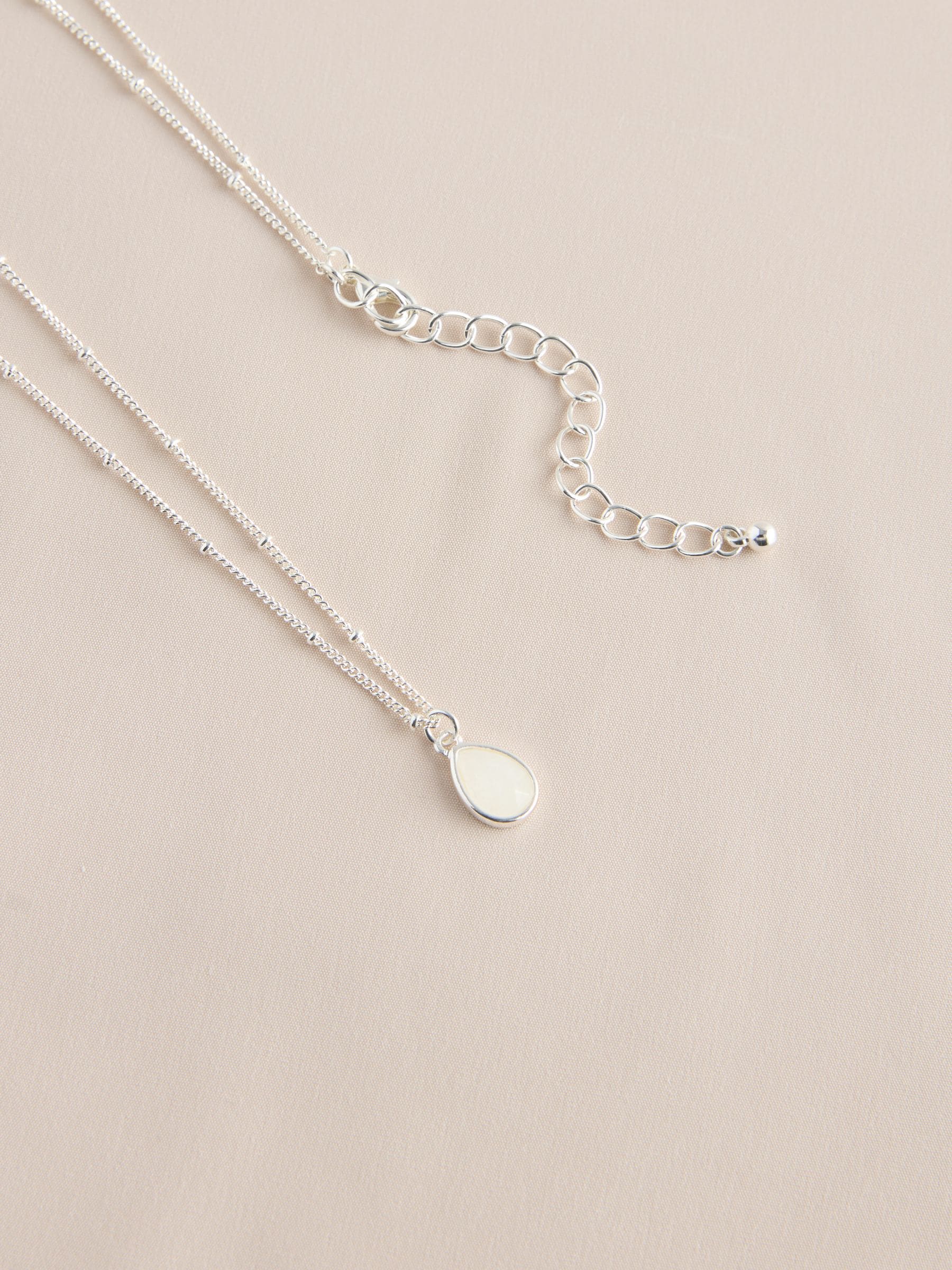 Gold tone semi-precious stone pendant necklace, UK version