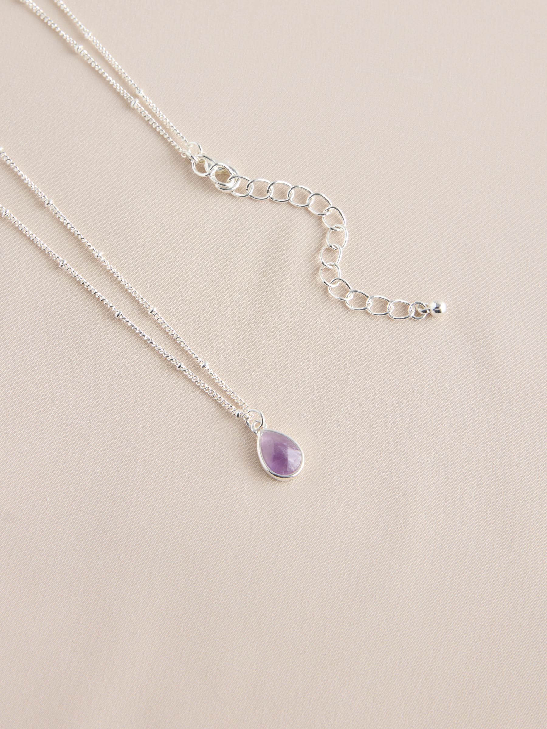 Gold tone semi-precious stone pendant necklace, UK version