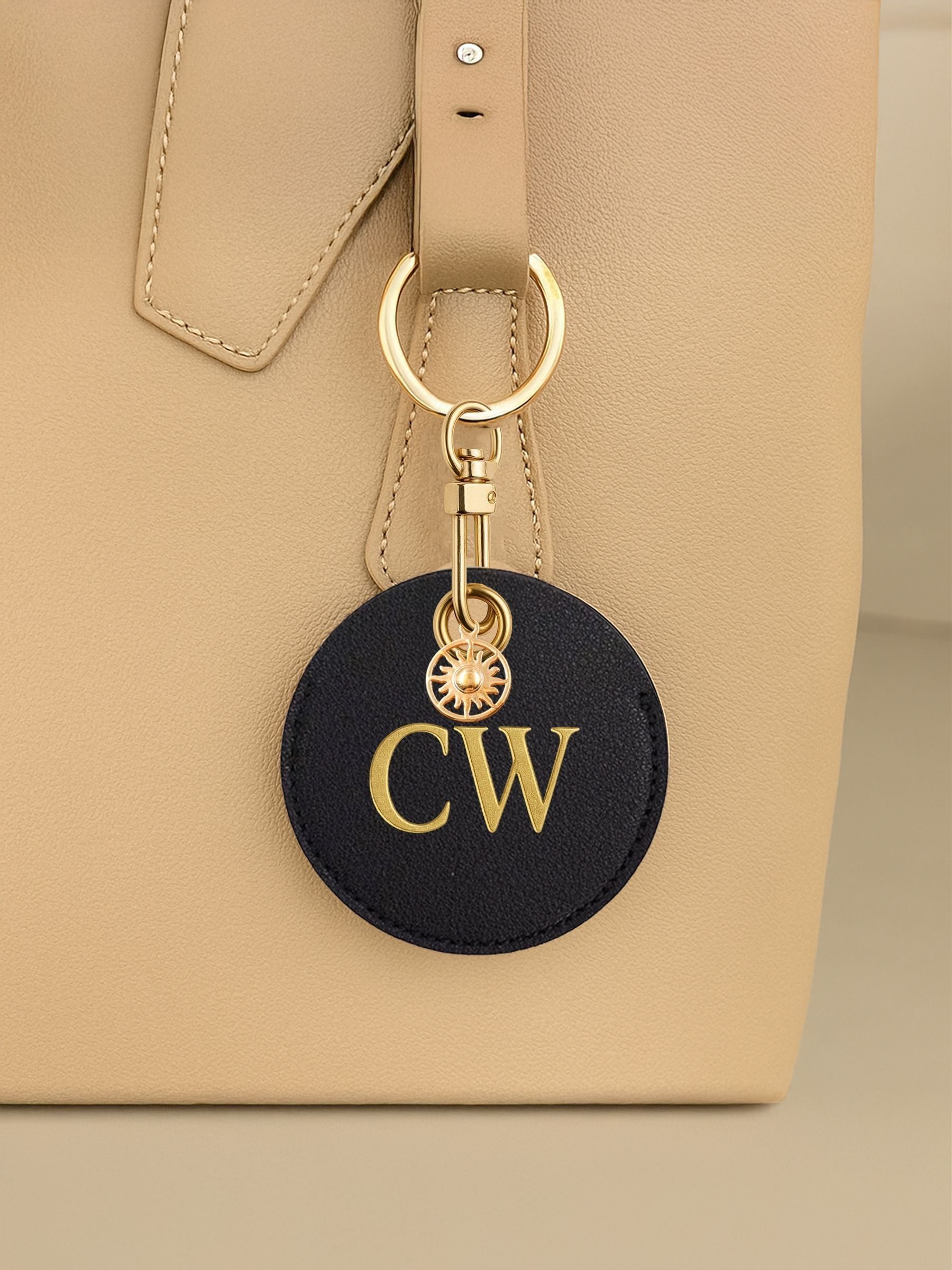 Jonnys Sister personalised faux leather bag charm with gold sun charm (British brand)
