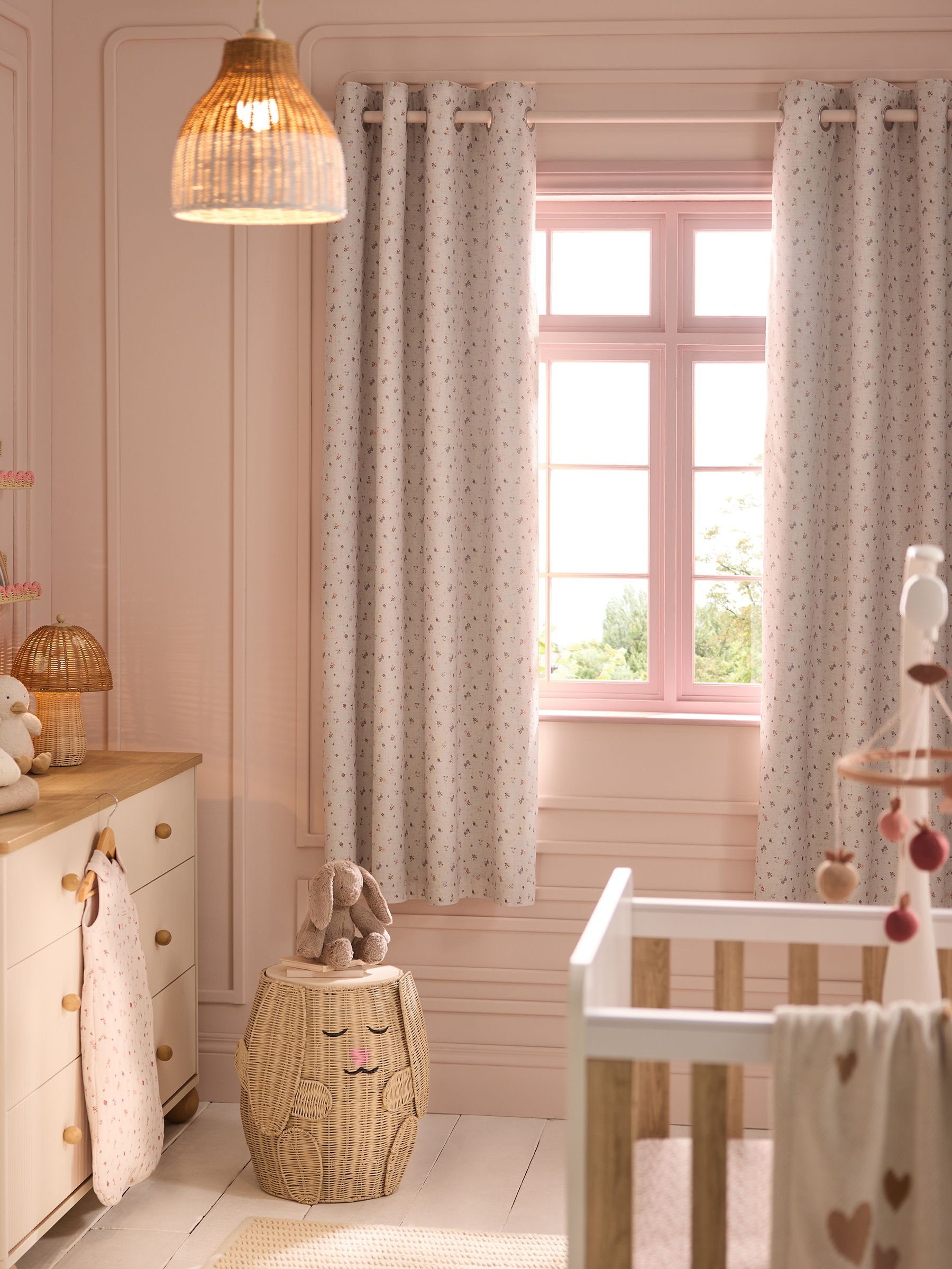Pink ditsy eyelet blackout curtains, imported from the UK