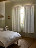 Neutral Mini Jungle pencil pleat blackout curtains imported from the UK