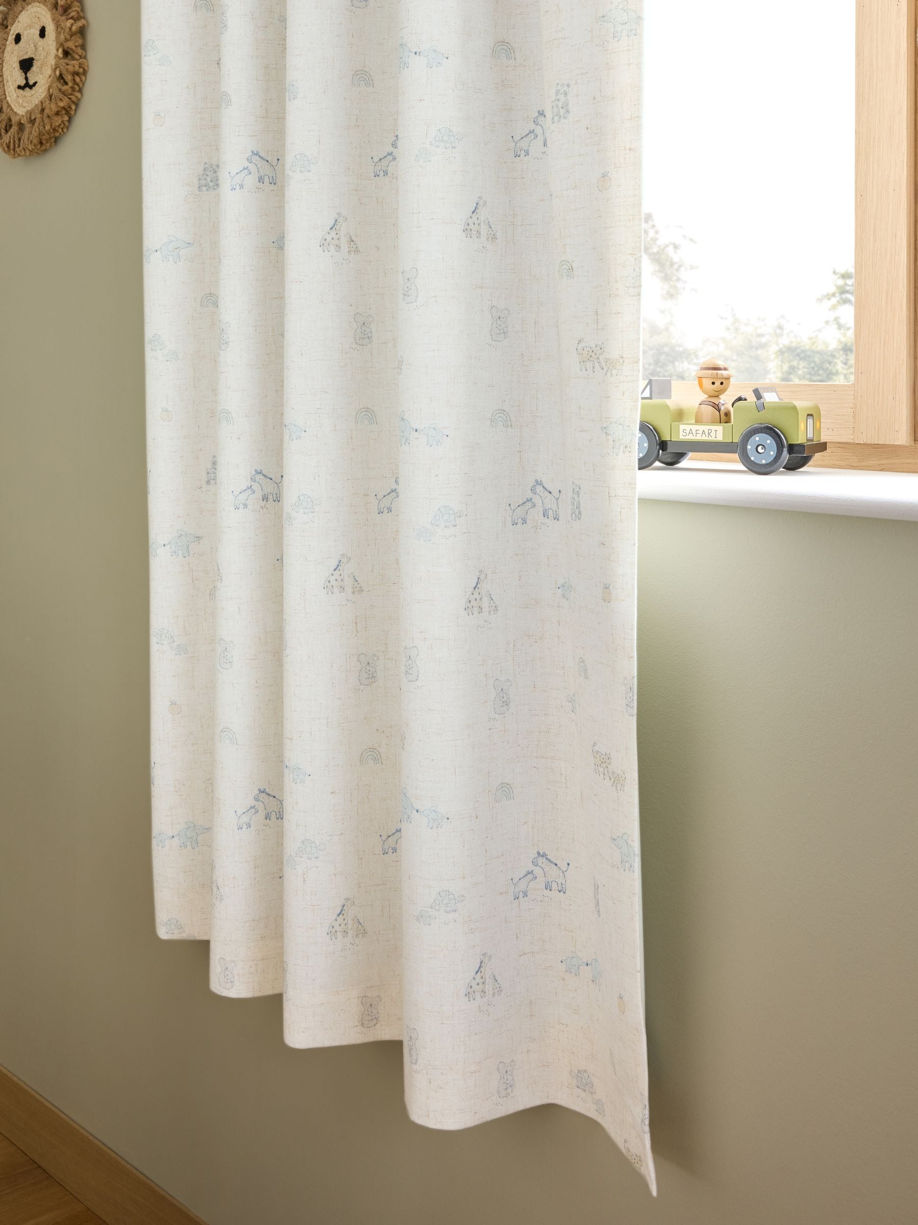 Neutral Mini Jungle pencil pleat blackout curtains imported from the UK