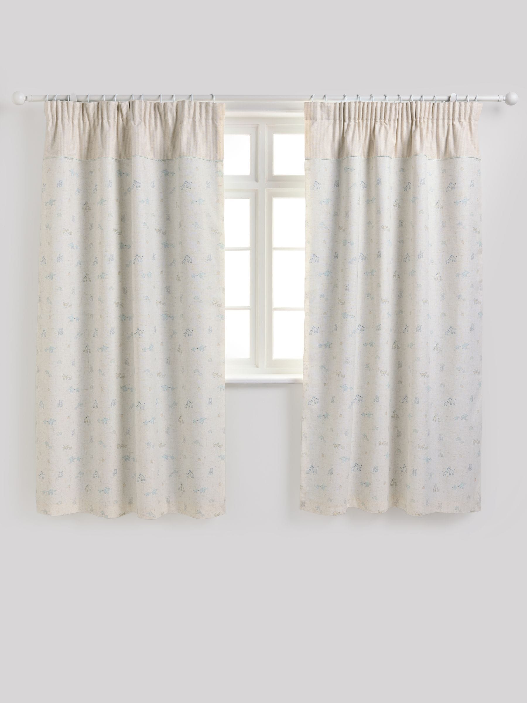 Neutral Mini Jungle pencil pleat blackout curtains imported from the UK