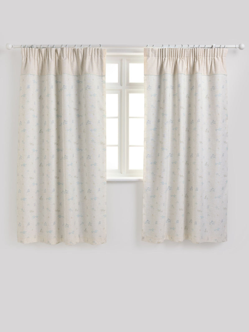 Neutral Mini Jungle pencil pleat blackout curtains imported from the UK