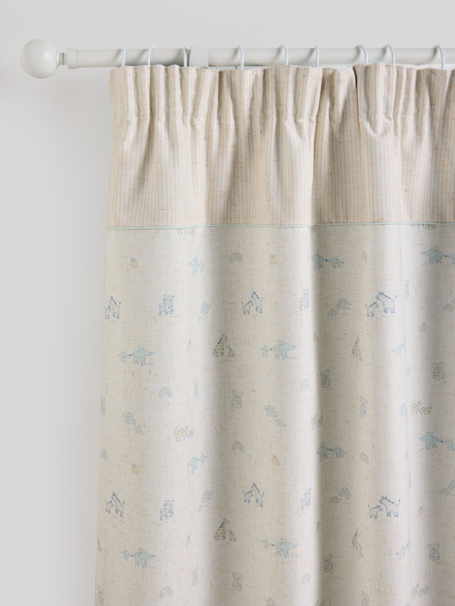 Neutral Mini Jungle pencil pleat blackout curtains imported from the UK