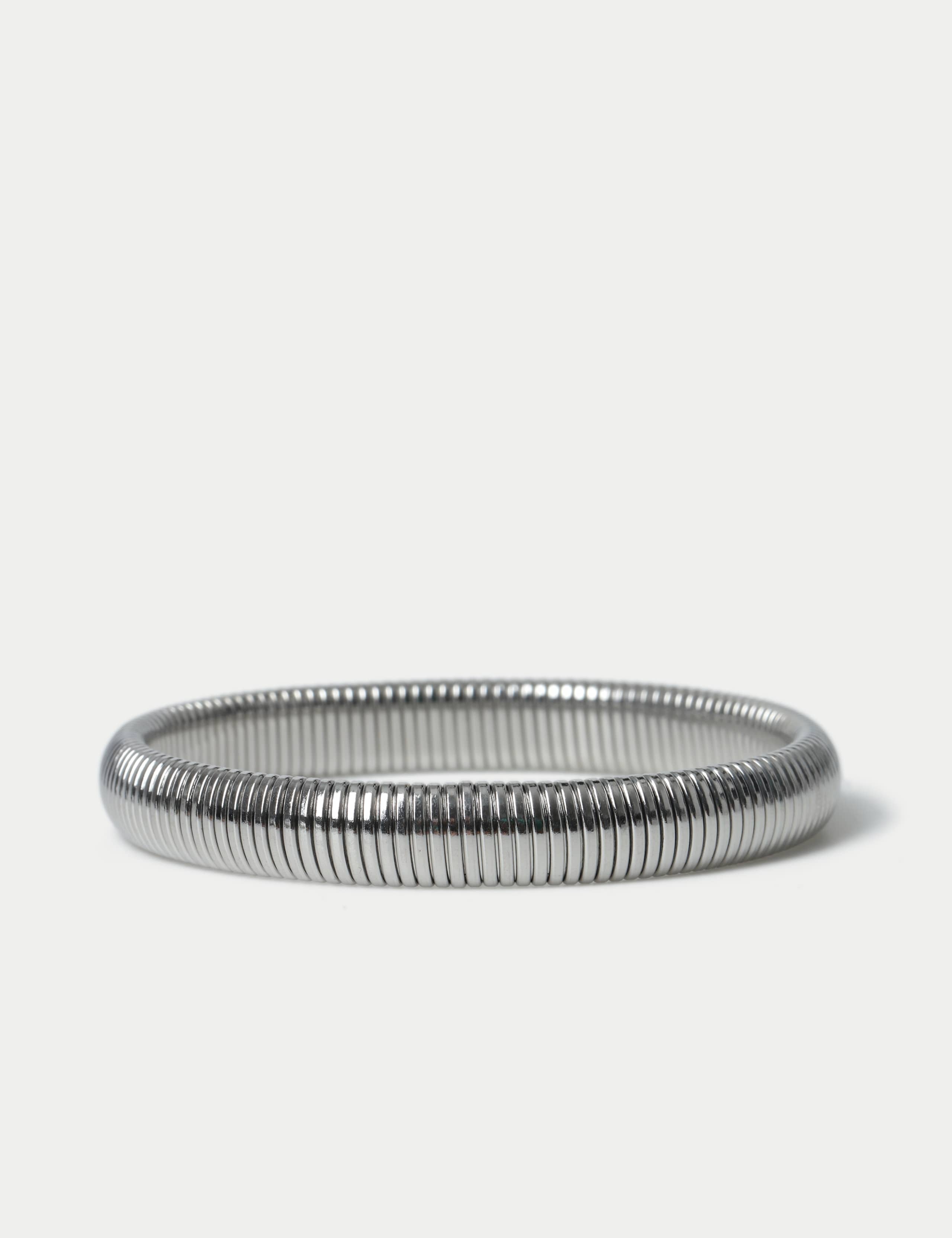 M&S silver tone stainless steel stretch bracelet, imported from the UK
