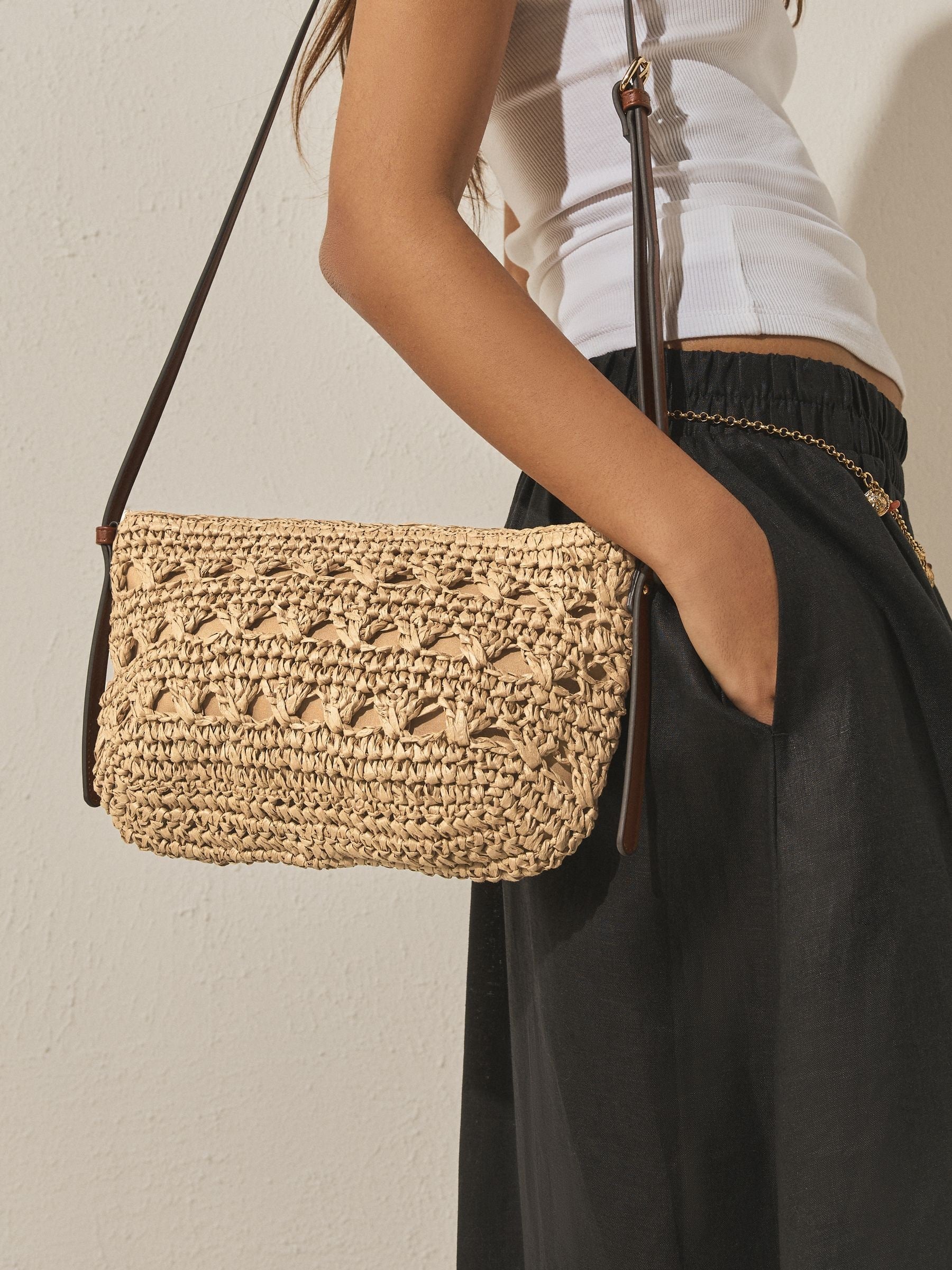 Natural raffia effect cross-body bag with recycled lining (British brand)