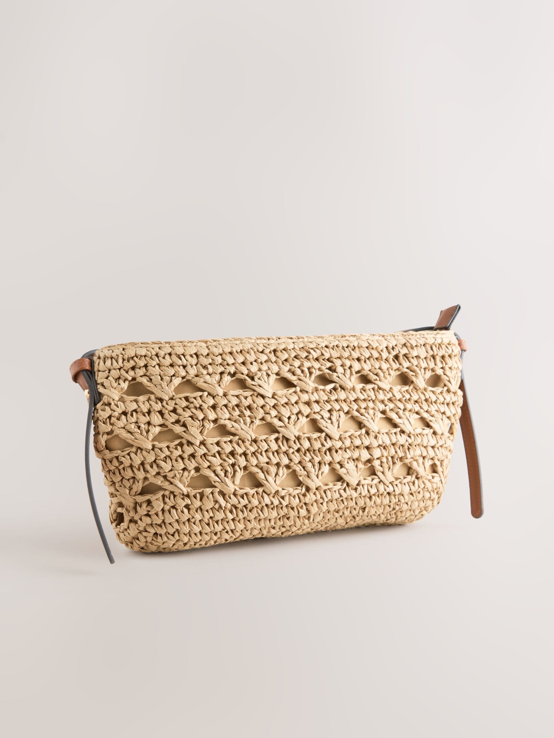 Natural raffia effect cross-body bag with recycled lining (British brand)