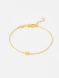 Oliver Bonas gold tone paw print charm bracelet, imported from the UK