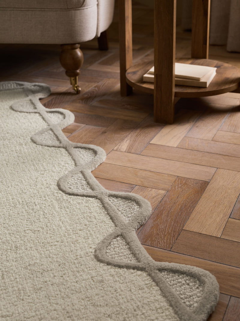 Natural scallop edge wool rug, imported from the UK