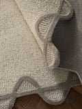 Natural scallop edge wool rug, imported from the UK
