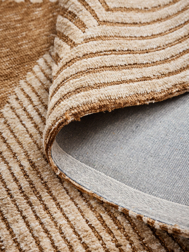 Ochre yellow abstract curve rug made from recycled polyester, UK version