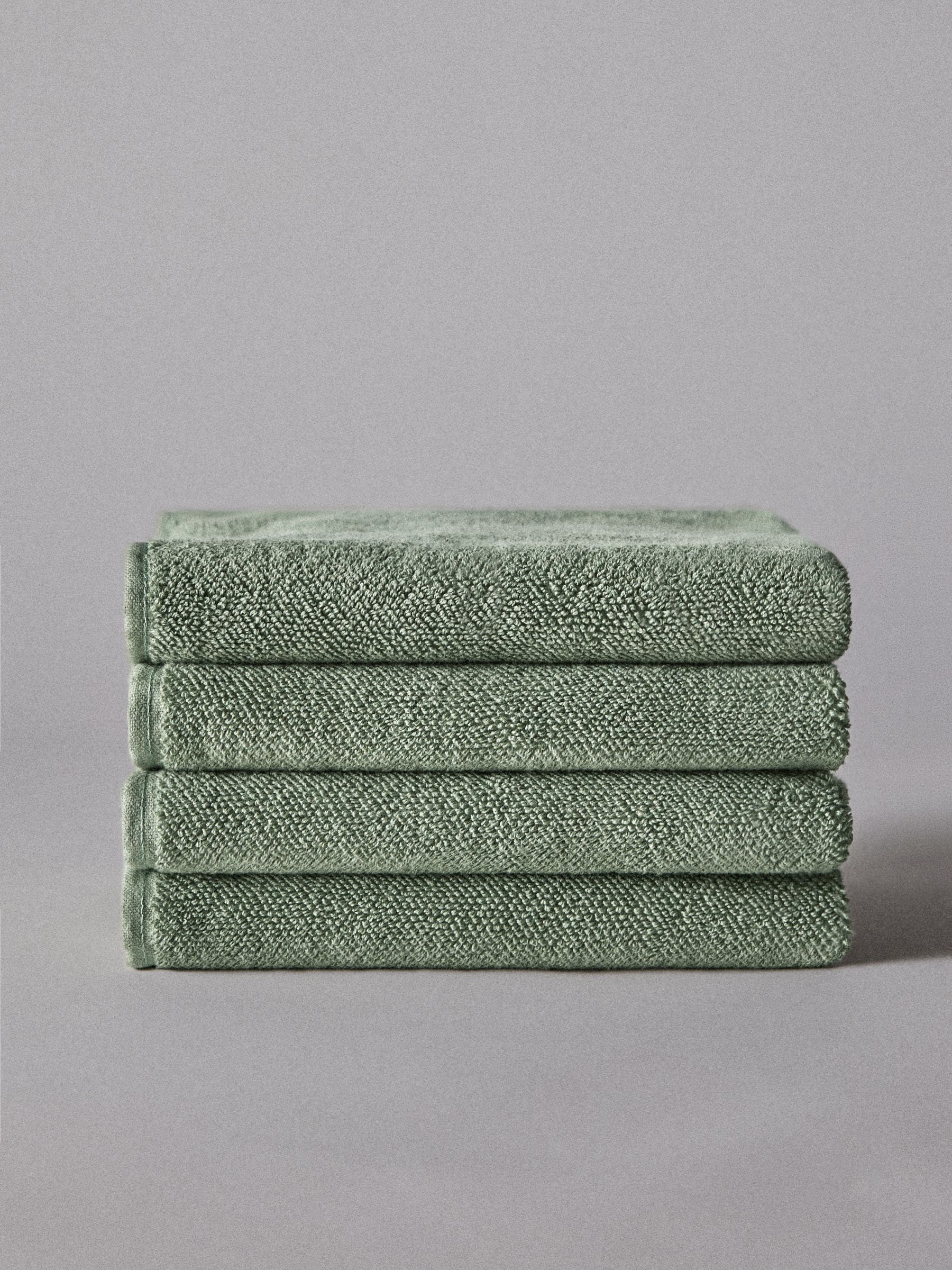 The Set sage green popcorn textured hand towels 4 pack, UK version