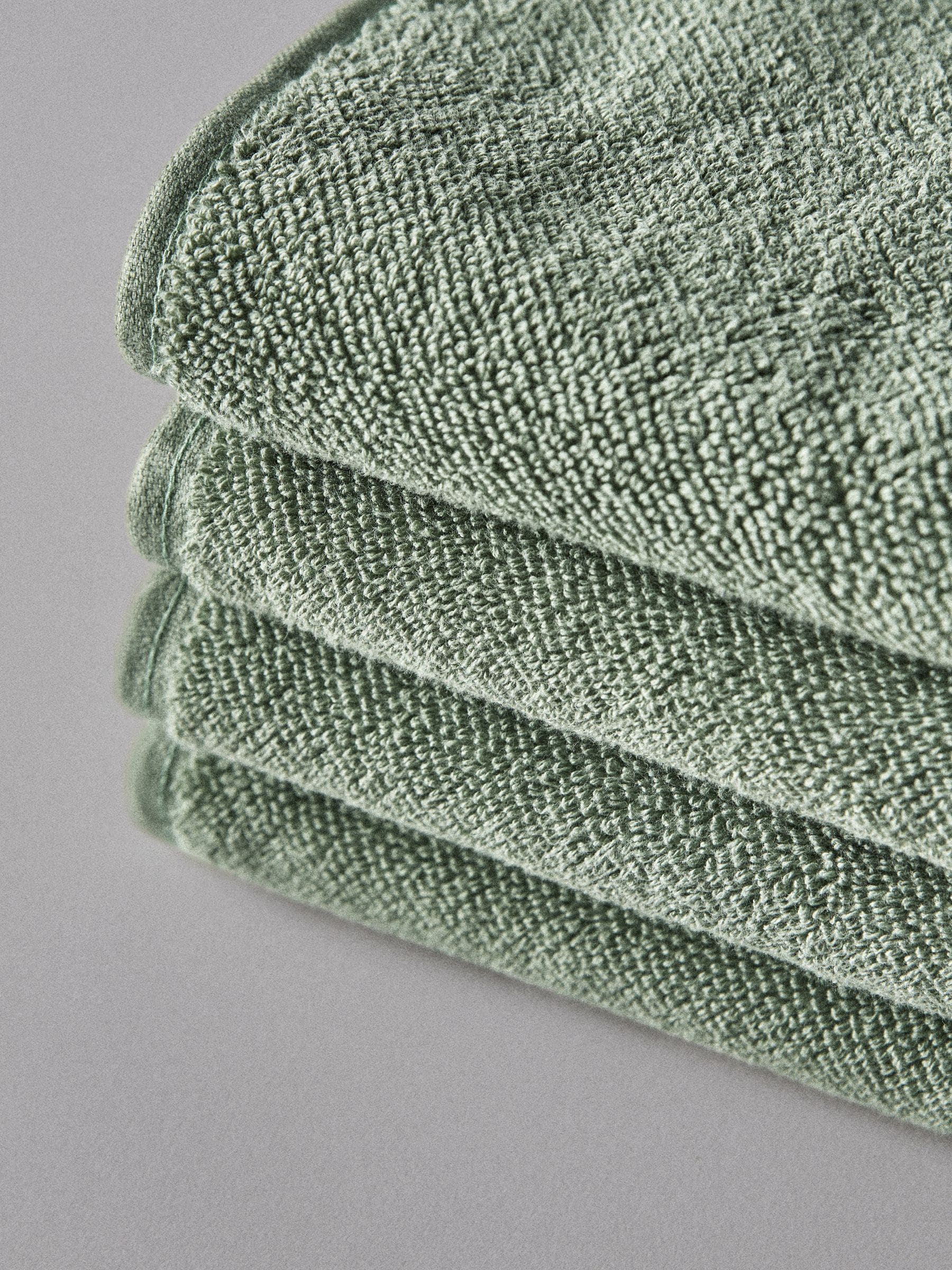 The Set sage green popcorn textured hand towels 4 pack, UK version