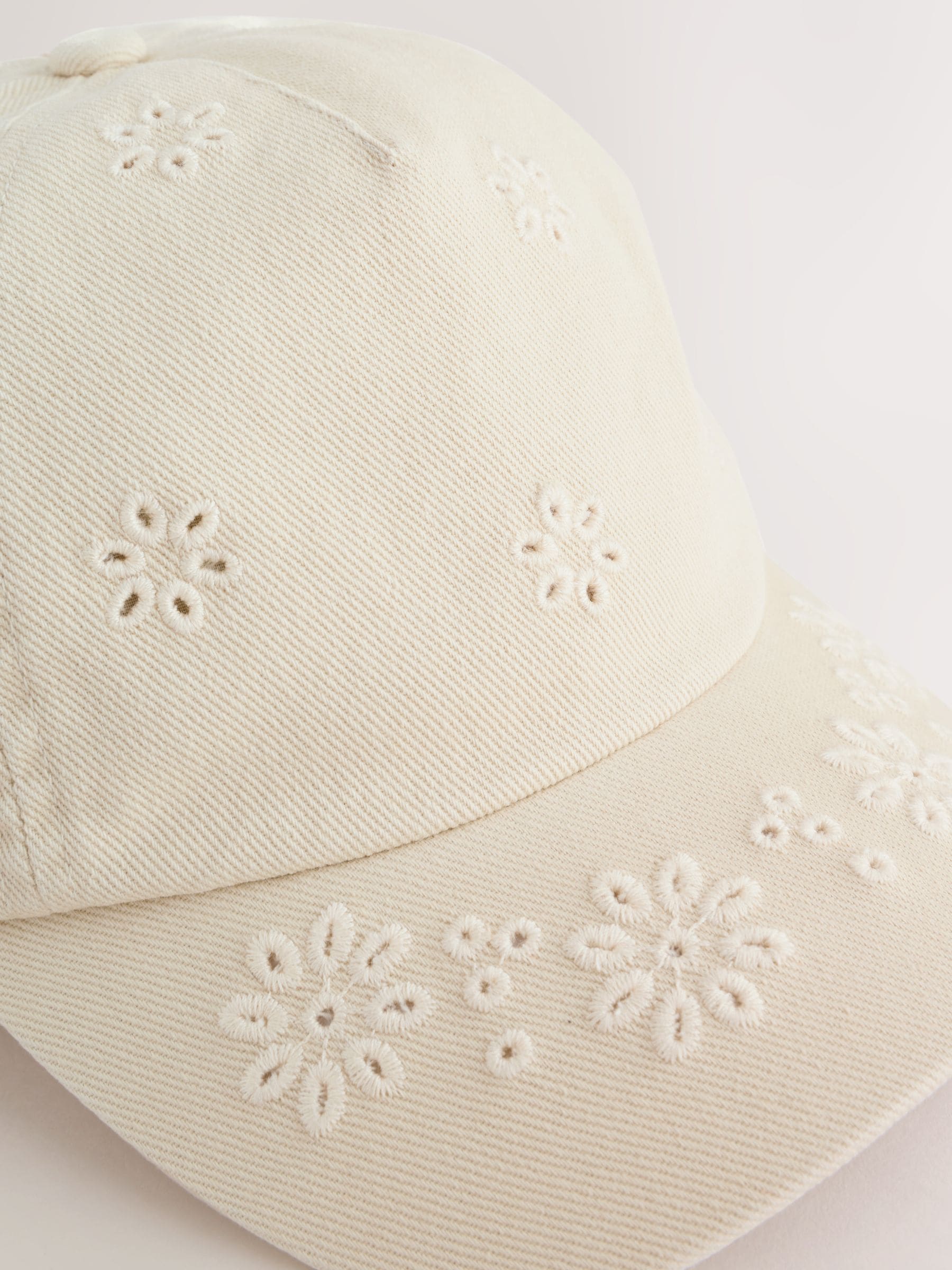 Children's cream baseball cap with laser-cut embroidery (British brand)