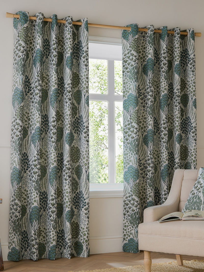 Wylder green floral jacquard curtains with eyelet header - British product