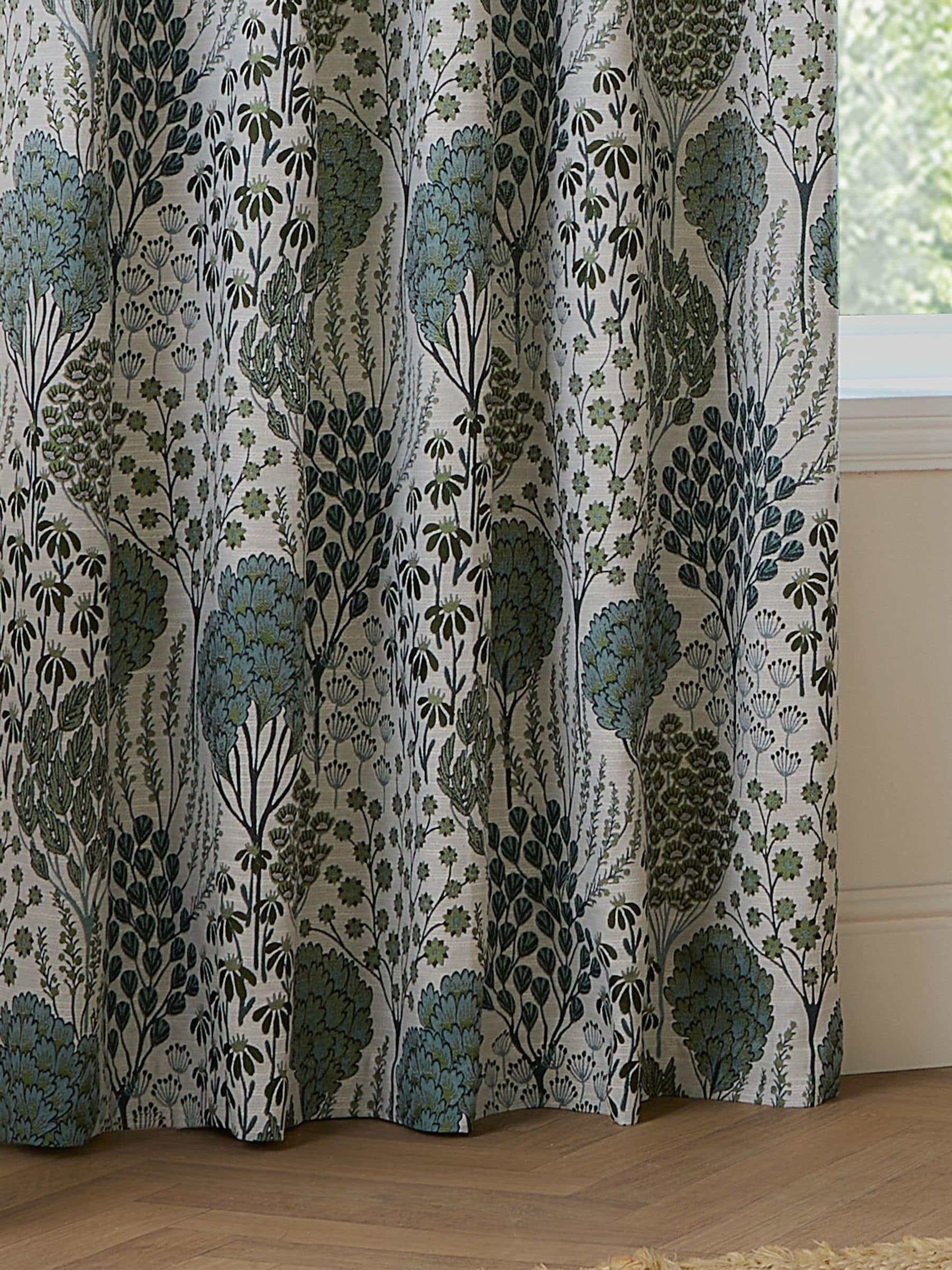 Wylder green floral jacquard curtains with eyelet header - British product