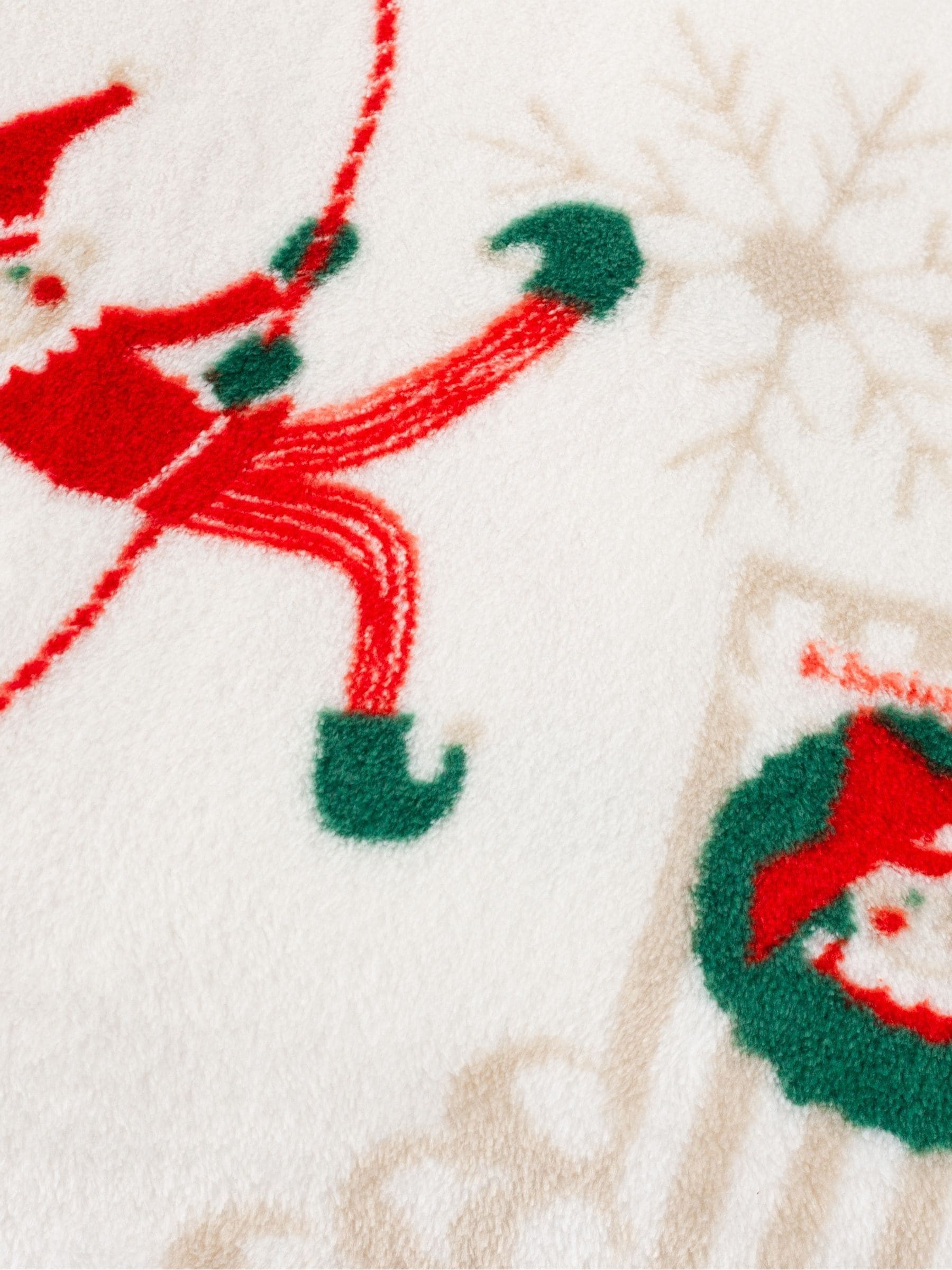 Duvet Day Elfie fleece throw with elf print, imported from the UK