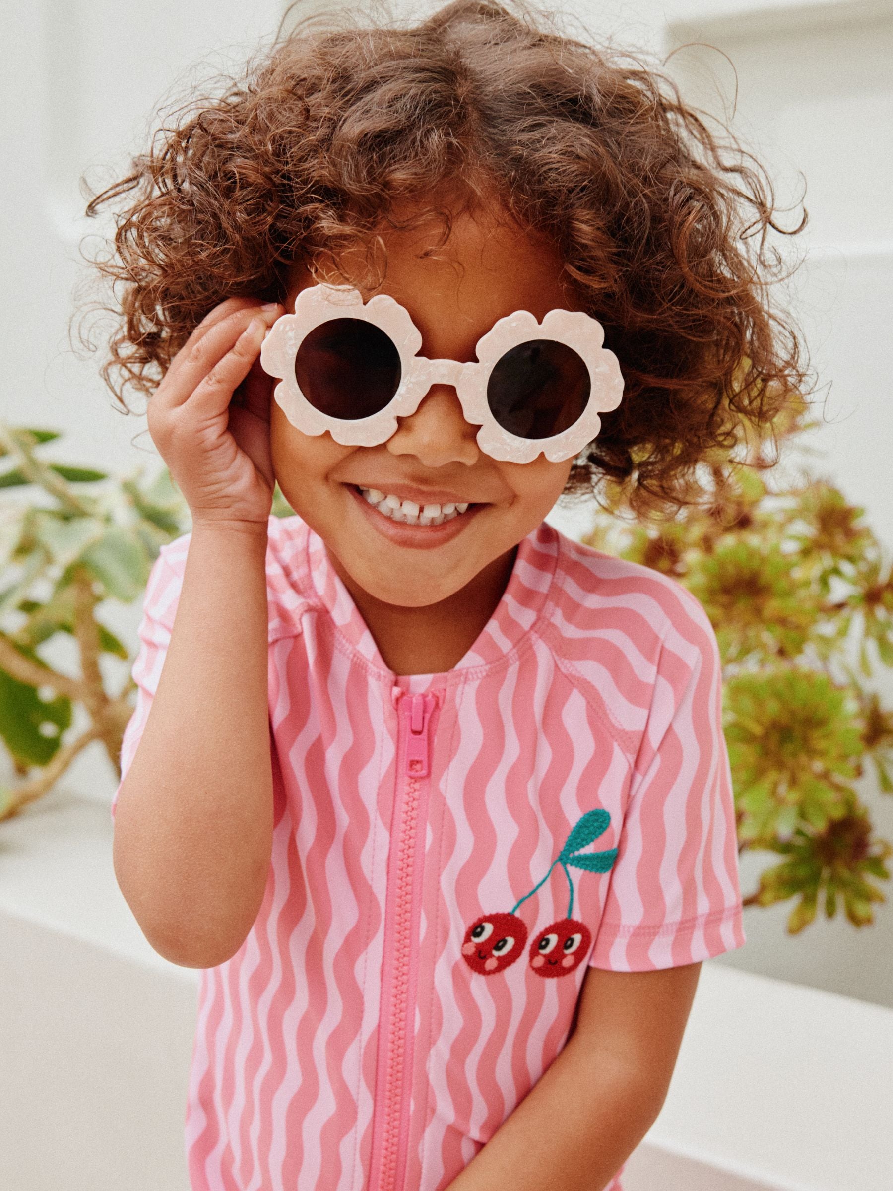 Light pink flower sunglasses for children (British brand)