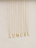 Inicio M initial pendant with mother of pearl and 17-inch chain, UK version