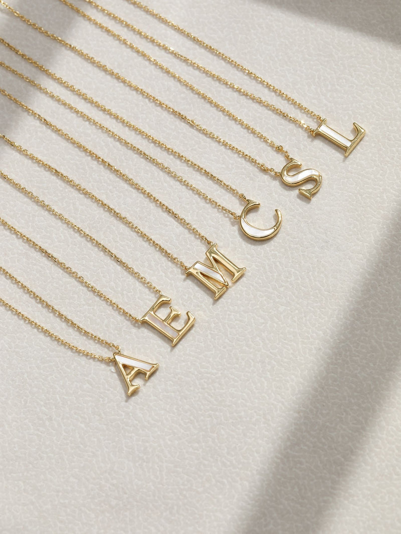 Inicio M initial pendant with mother of pearl and 17-inch chain, UK version