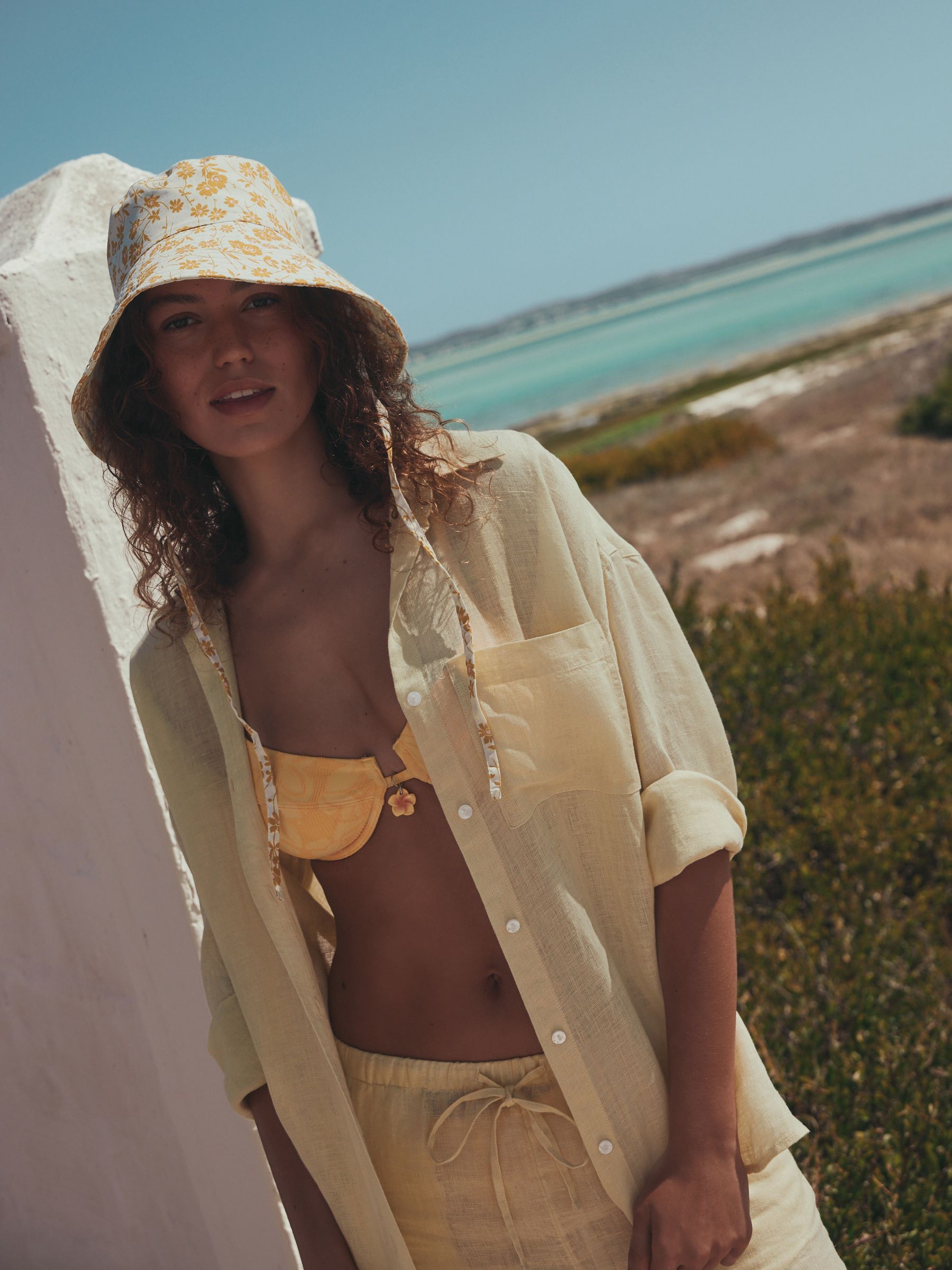 Orange floral oversized bucket hat made from 100% cotton - British product