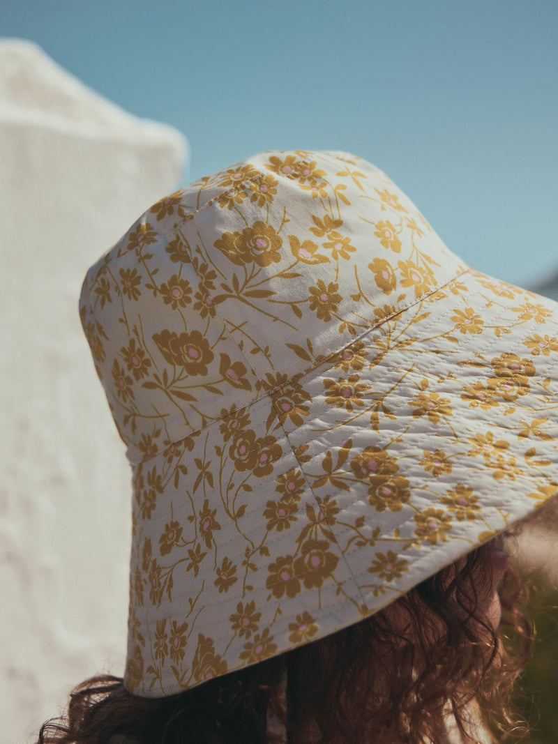 Orange floral oversized bucket hat made from 100% cotton - British product