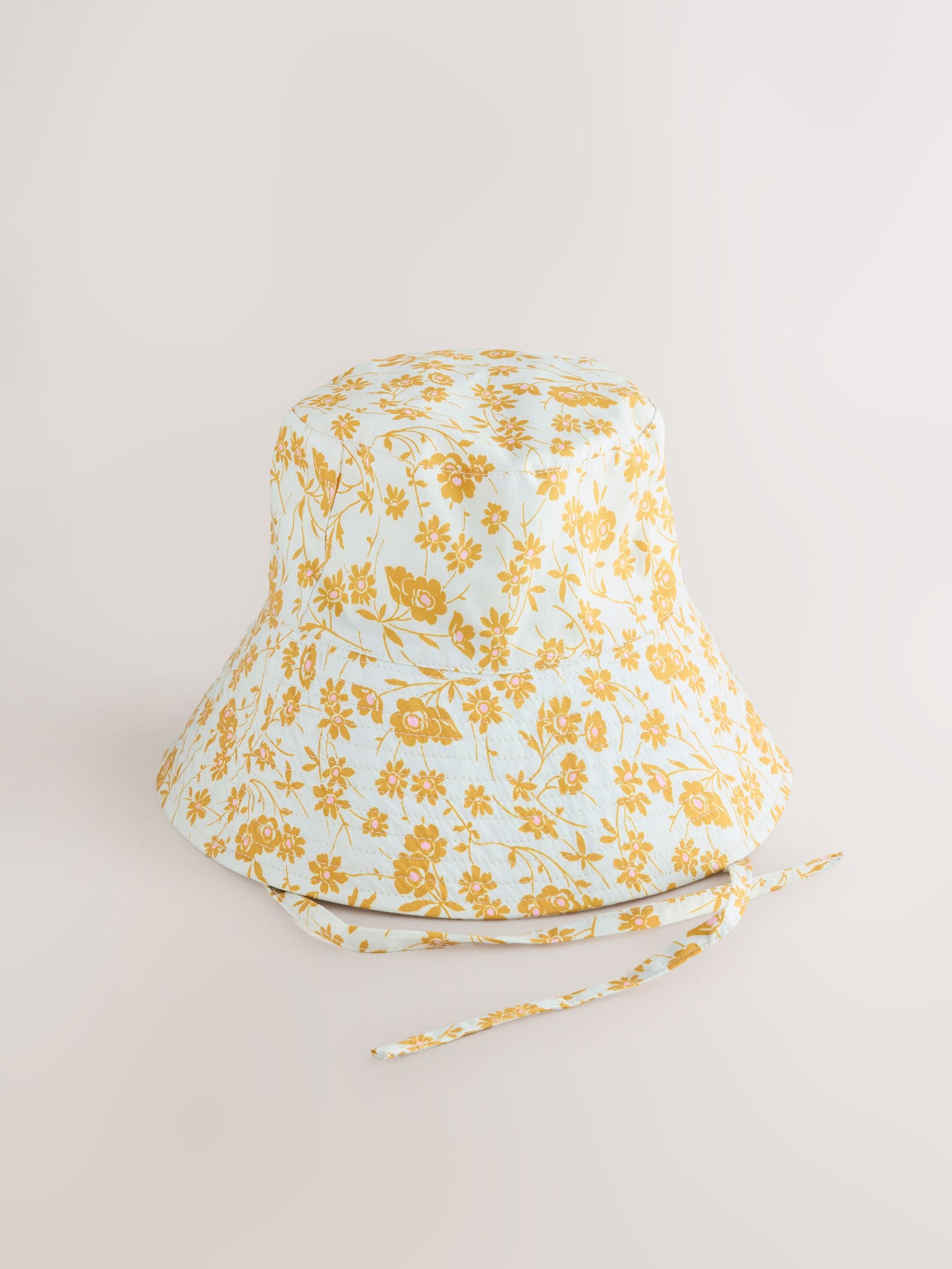 Orange floral oversized bucket hat made from 100% cotton - British product