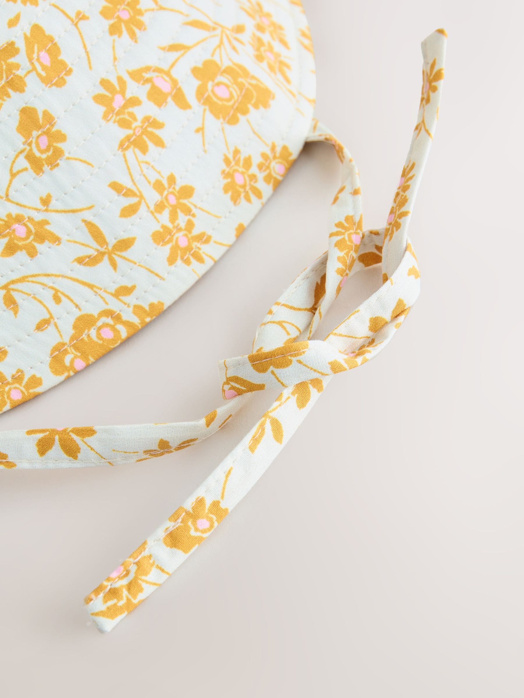 Orange floral oversized bucket hat made from 100% cotton - British product