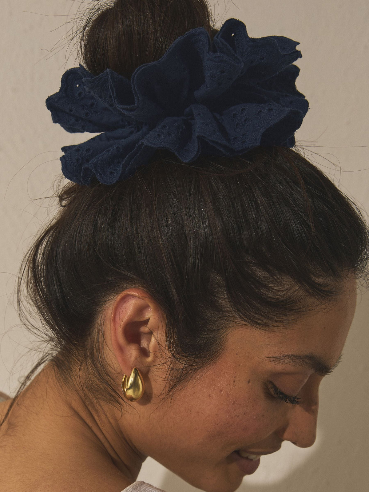 Navy broderie scrunchie with eyelet embroidery, imported from the UK