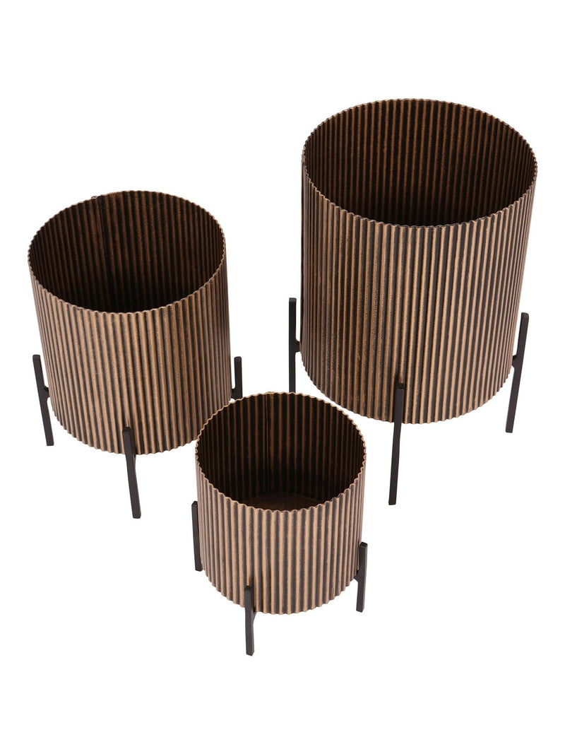 Libra Interiors set of three gold metal planters, UK version