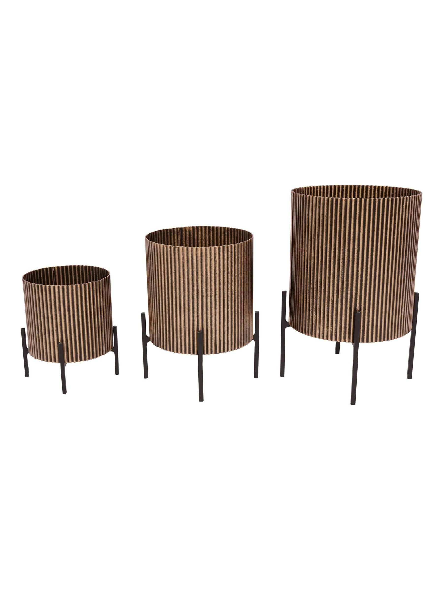 Libra Interiors set of three gold metal planters, UK version