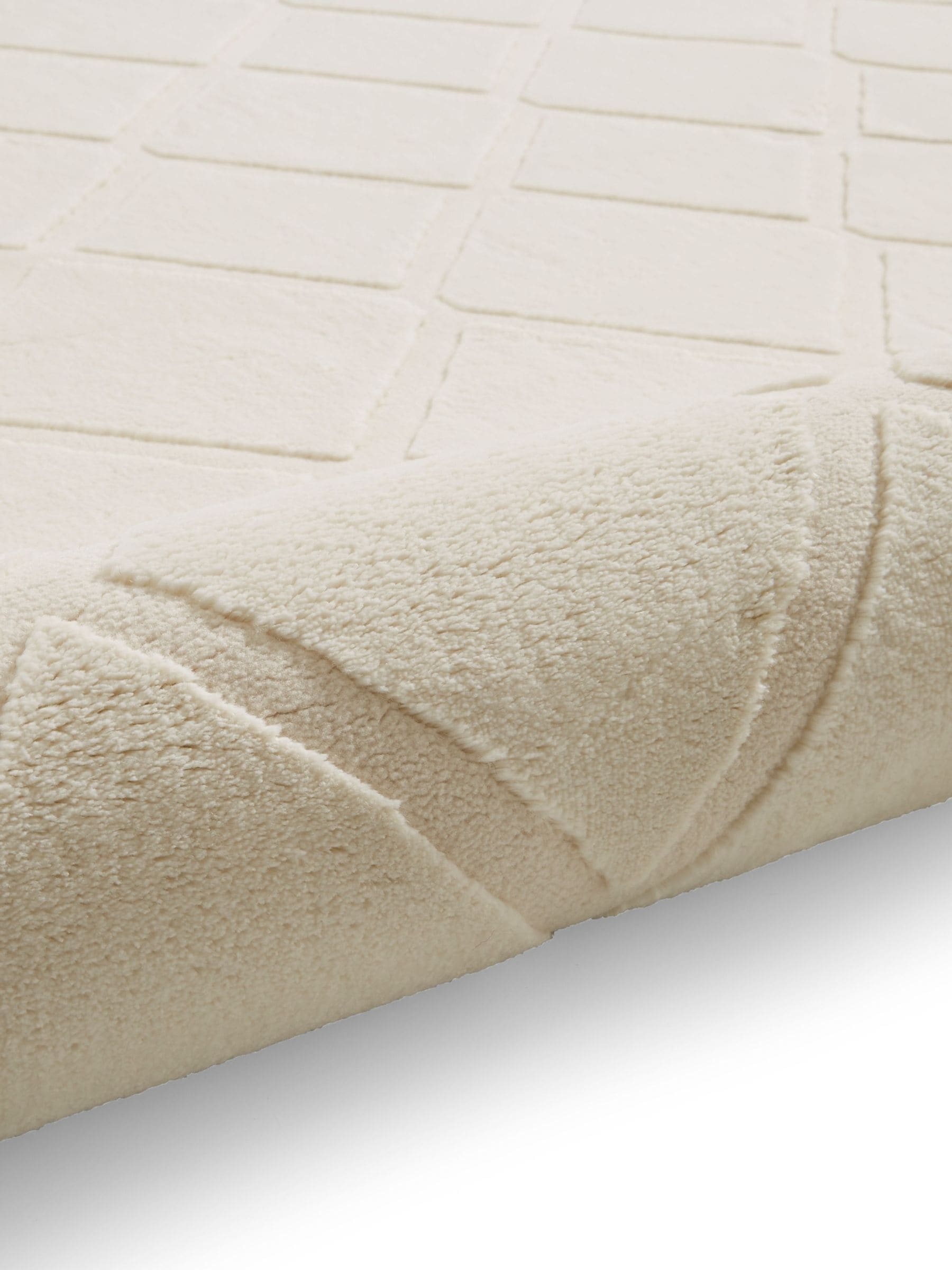 Catherine Lansfield cream cosy diamond washable rug, imported from the UK