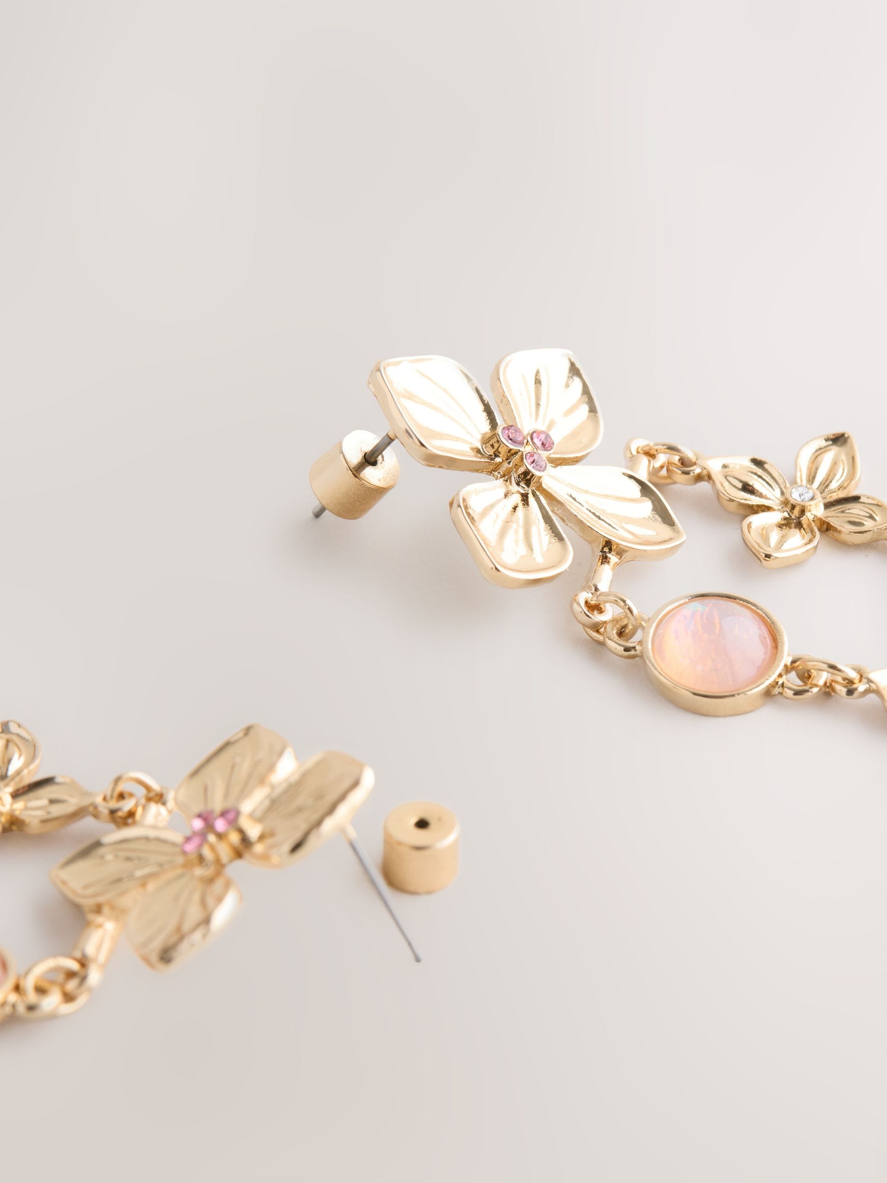 Gold tone floral drop stud earrings, UK version