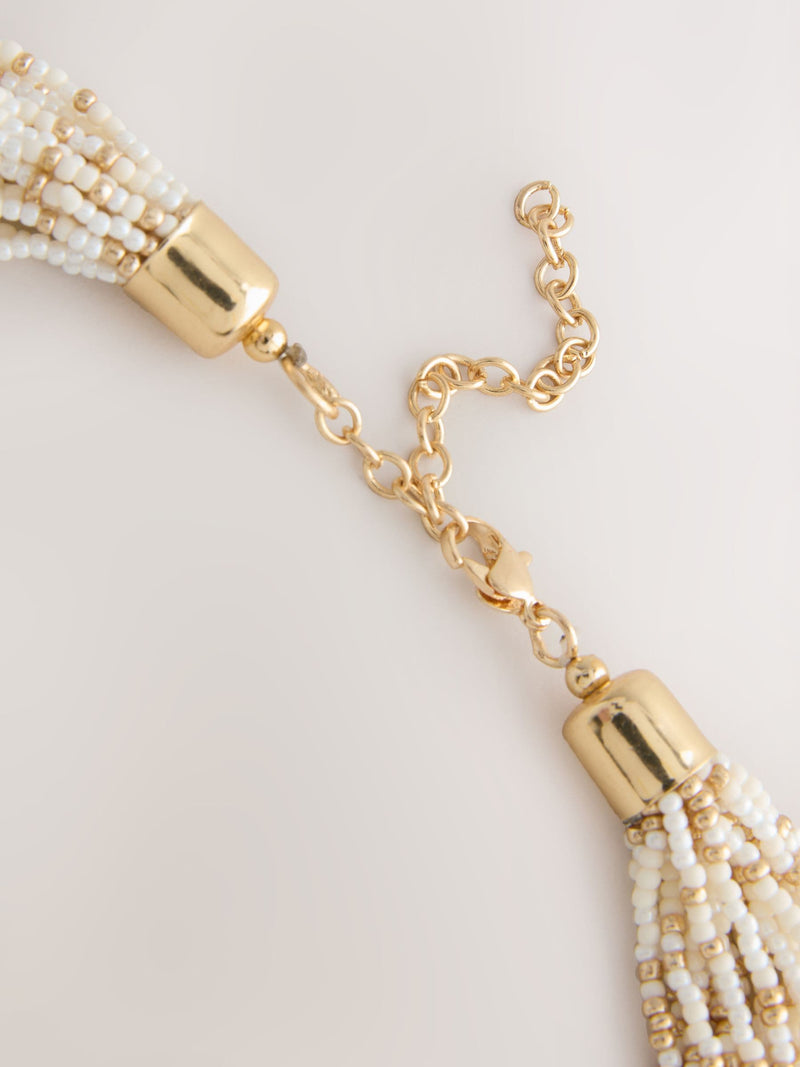 Statement necklace gold tone ecru beads - British product